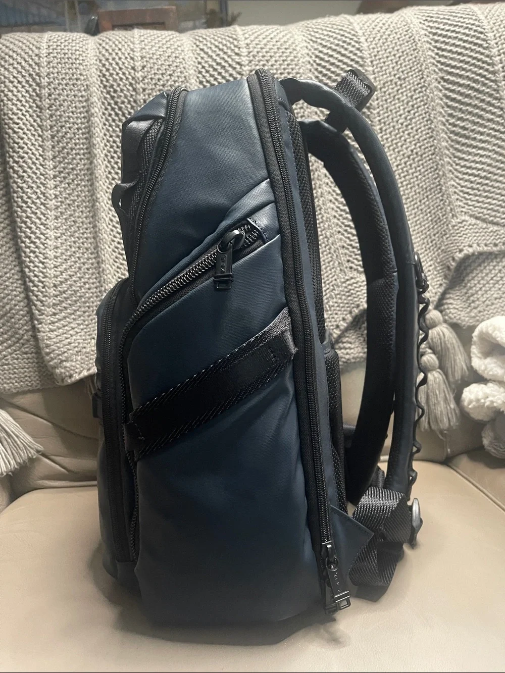Tumi Men's Blue Travel Backpack with Front Zip Pocket.  It has never been used